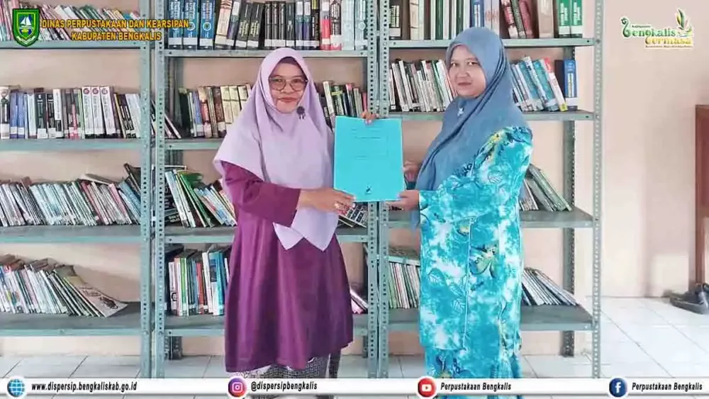 Penandatanganan MoU SMPN 9 Mandau dengan UPT Perpustakaan Kecamatan Mandau